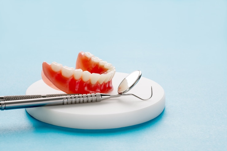 How Do Dentures Stay in Place?